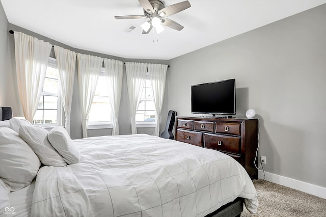 bedroom with ceiling fan and carpet floors