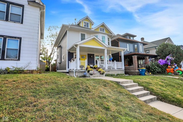 view of front of house featuring a porch and a front yard