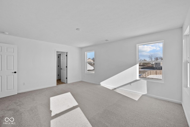 empty room featuring light colored carpet