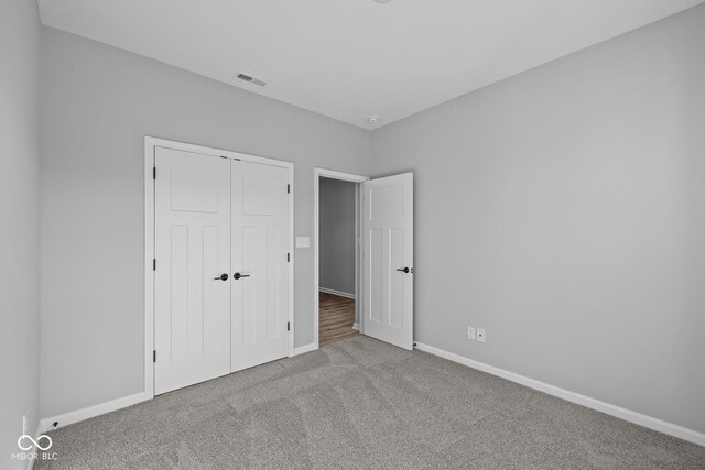 10618 Maidenhair Dr, Indianapolis, IN 46239 - unfurnished bedroom with carpet, baseboards, and a closet