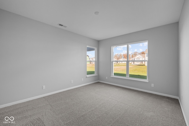 empty room featuring carpet flooring