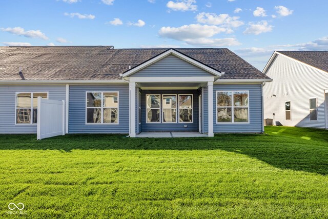 10618 Maidenhair Dr, Indianapolis, IN 46239 - back of property with a lawn, a patio, and a shingled roof