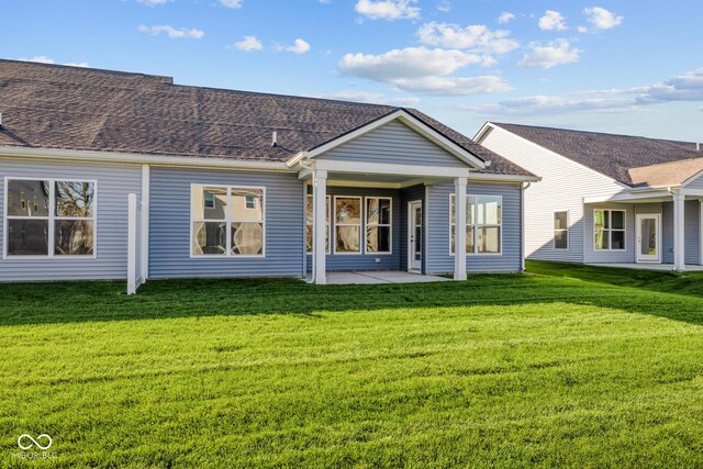 10618 Maidenhair Dr, Indianapolis, IN 46239 - rear view of property featuring a yard