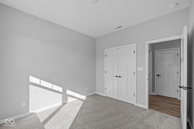 10618 Maidenhair Dr, Indianapolis, IN 46239 - unfurnished bedroom with carpet, baseboards, and a closet