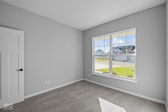 10618 Maidenhair Dr, Indianapolis, IN 46239 - carpeted empty room featuring baseboards