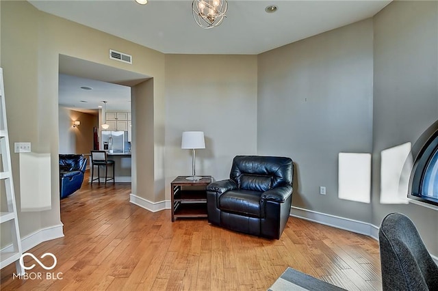 sitting room featuring light hardwood / wood-style flooring