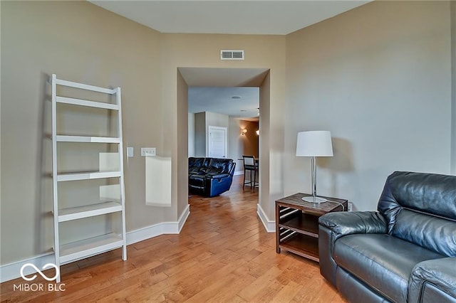 sitting room with light hardwood / wood-style floors