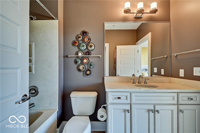 full bathroom with  shower combination, vanity, and toilet