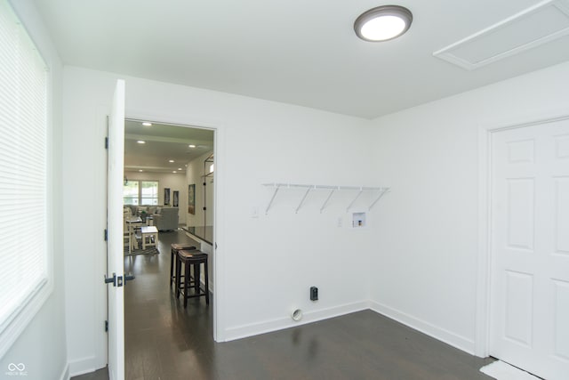 laundry room with hookup for a washing machine and dark hardwood / wood-style flooring