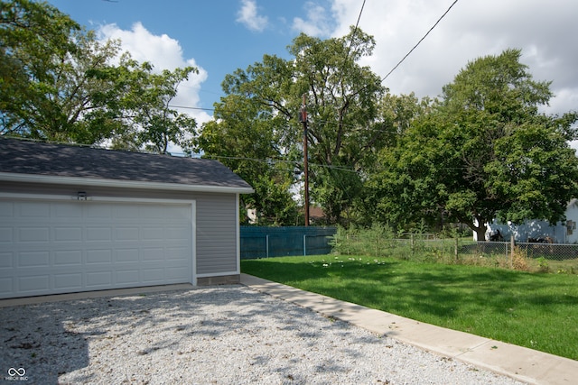 garage with a yard