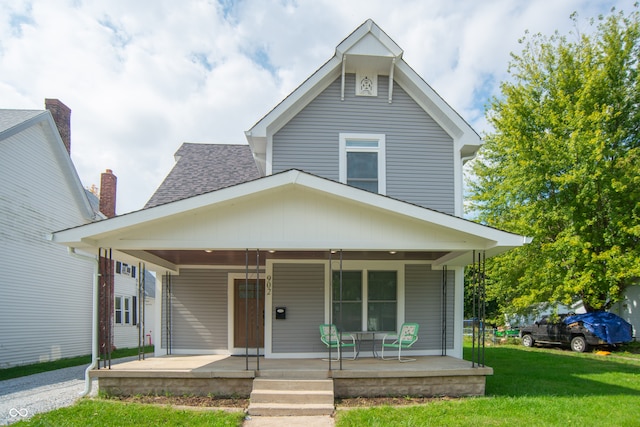 bungalow featuring a front yard and a porch