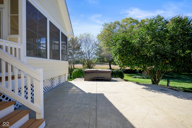 view of patio with a hot tub