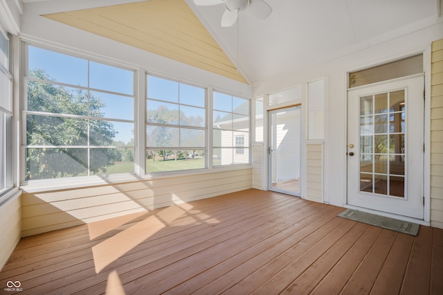 unfurnished sunroom with ceiling fan and vaulted ceiling