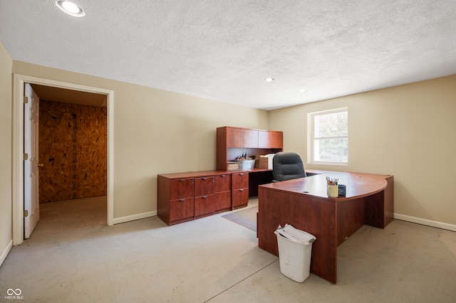 office with a textured ceiling