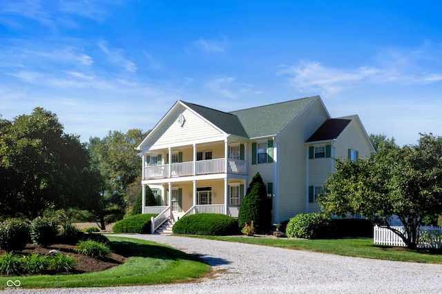 view of front facade with a porch and a balcony