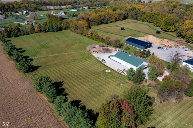 birds eye view of property with a rural view