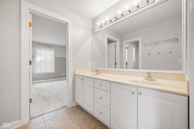 bathroom with tile patterned floors and vanity