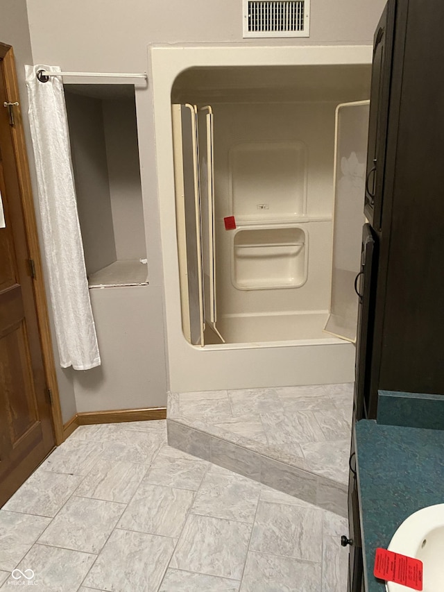 bathroom with vanity and tub / shower combination