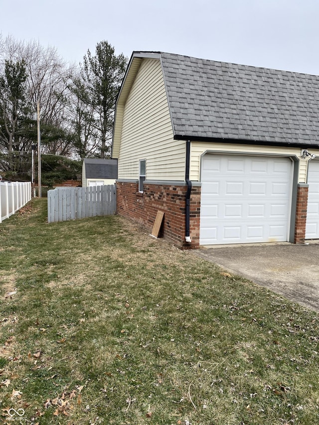 view of side of home with a yard