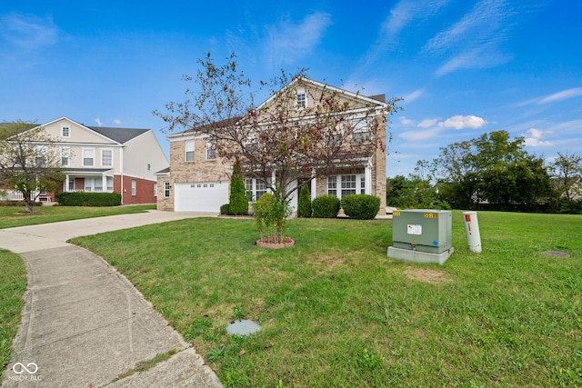 view of front of house featuring a garage and a front lawn