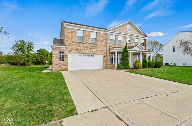 view of front of home with a front yard and a garage