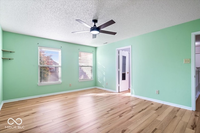 unfurnished bedroom with ceiling fan, a textured ceiling, and light hardwood / wood-style flooring