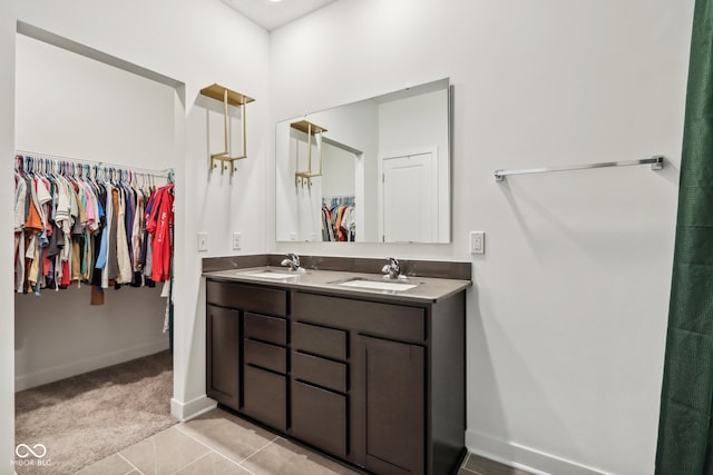 bathroom with tile patterned flooring and vanity