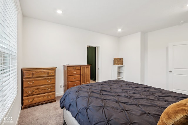 bedroom featuring light carpet