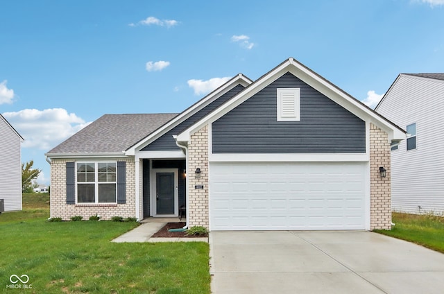 view of front of home featuring a garage and a front lawn