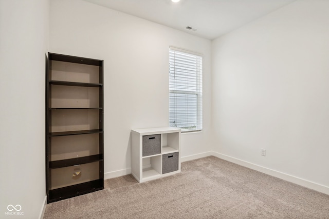 unfurnished bedroom with light carpet