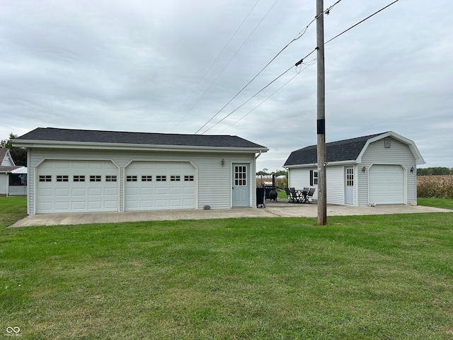 garage with a yard