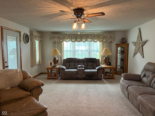 living room with carpet floors, a textured ceiling, and ceiling fan