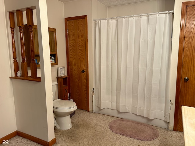 bathroom with shower / bath combo and toilet