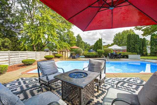 view of swimming pool with a patio area