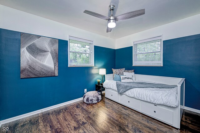 bedroom featuring multiple windows, ceiling fan, and hardwood / wood-style flooring