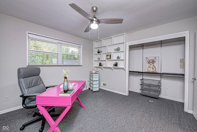 home office featuring dark carpet and ceiling fan