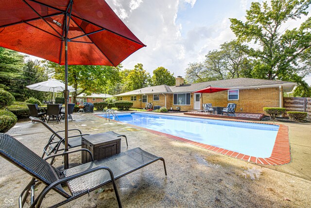 view of swimming pool with a patio