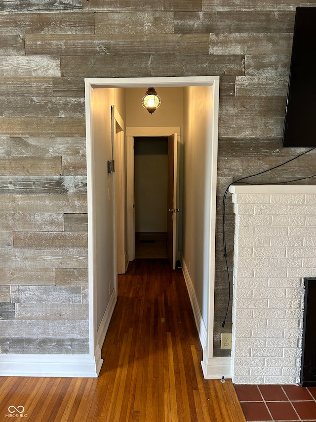 hallway featuring dark hardwood / wood-style flooring