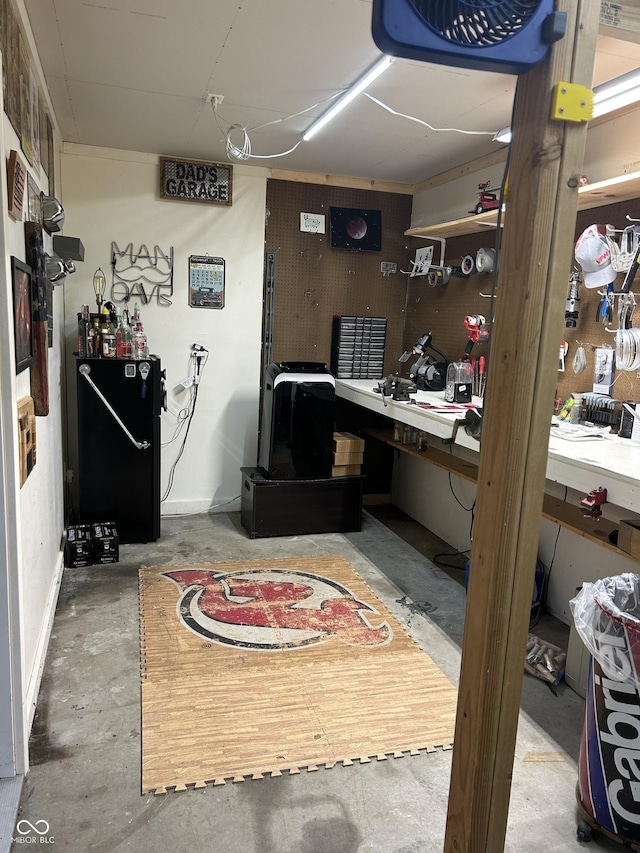 interior space with concrete flooring and a workshop area