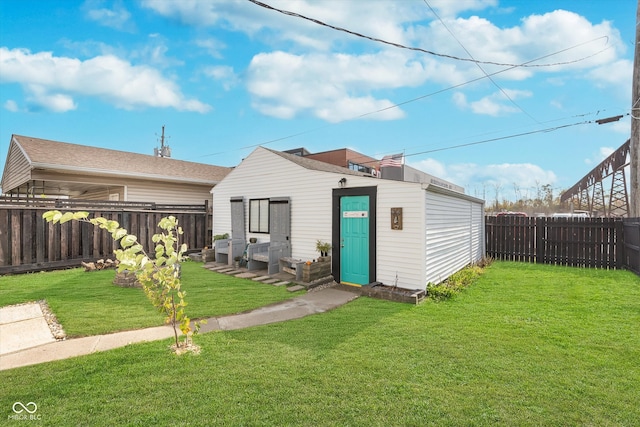 exterior space with a yard and an outdoor structure