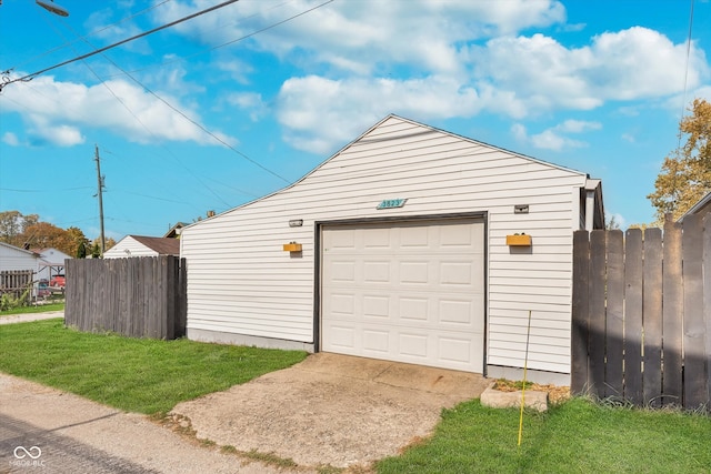 garage featuring a yard