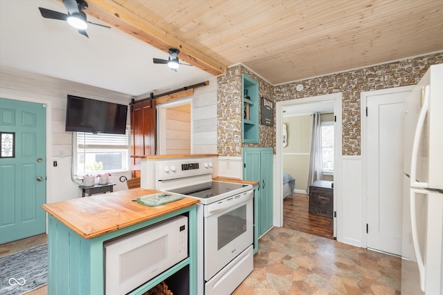 kitchen with a barn door, beamed ceiling, white appliances, wooden ceiling, and ceiling fan