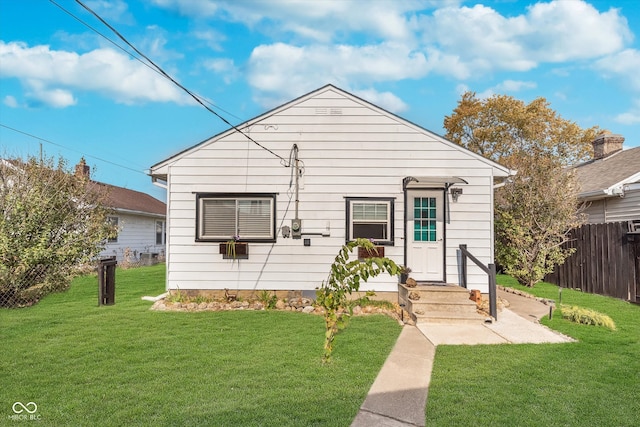 bungalow with a front yard