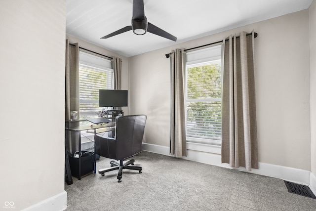 home office featuring ceiling fan and carpet