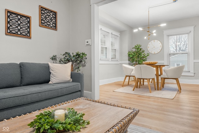 living room with a chandelier and hardwood / wood-style floors