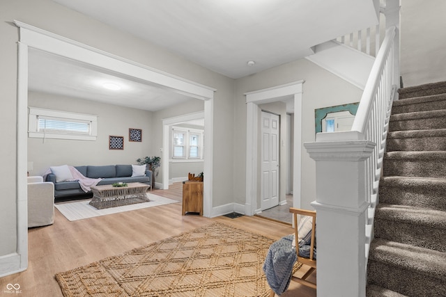 foyer featuring hardwood / wood-style floors and a healthy amount of sunlight