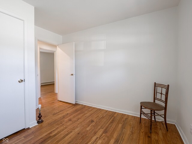 empty room featuring hardwood / wood-style flooring