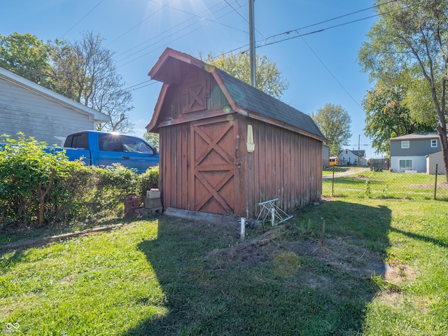 view of outbuilding featuring a yard