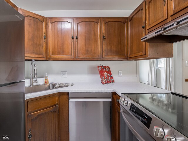 kitchen with appliances with stainless steel finishes and sink