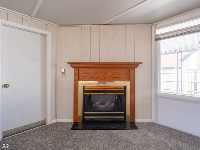 details featuring wooden walls, beamed ceiling, and carpet flooring